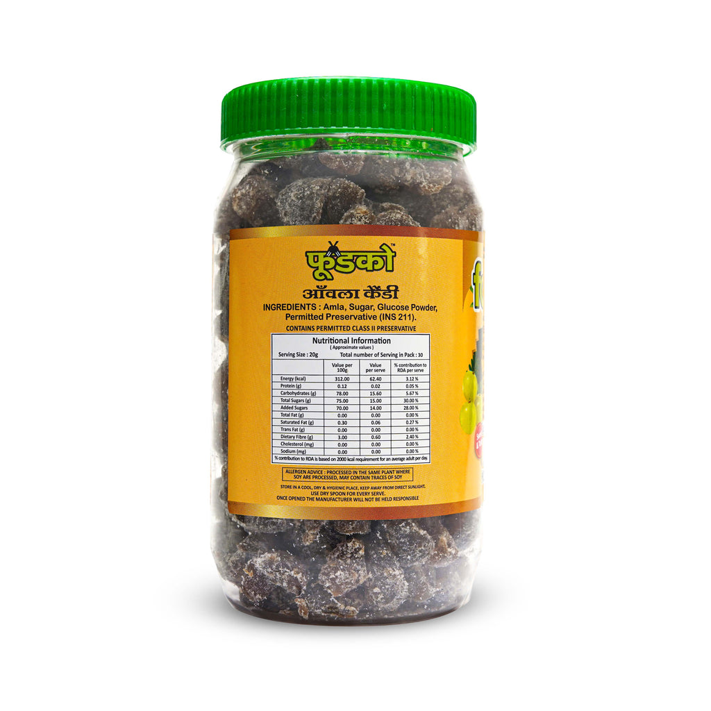 Jar of dried fruits with a green lid on a white background