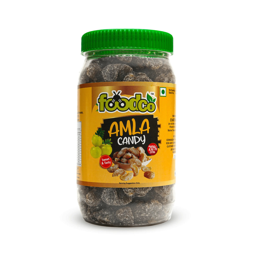 Jar of Amla candy with a yellow label and green lid on a white background