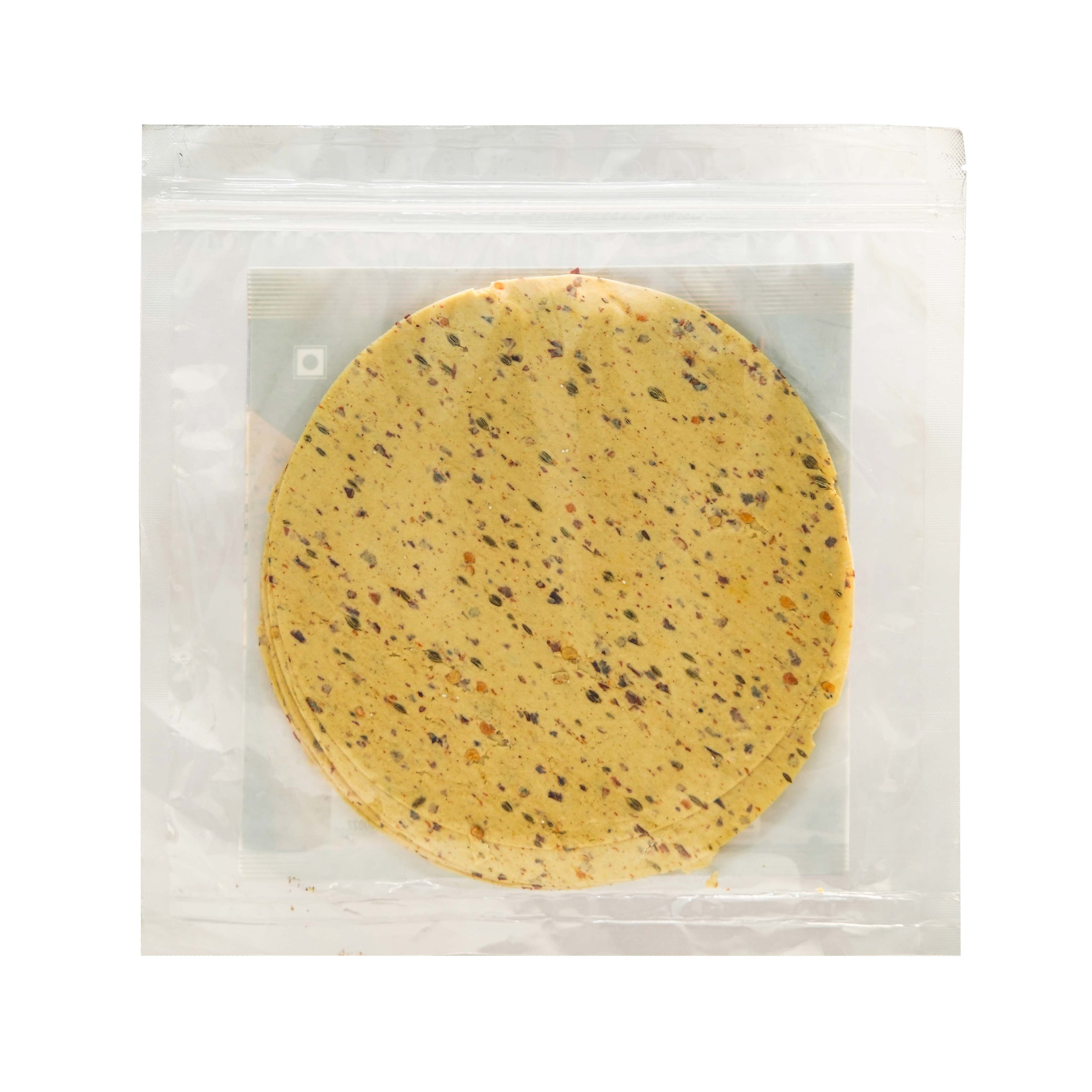 Round yellow cookie with specks in a clear plastic packaging on a white background