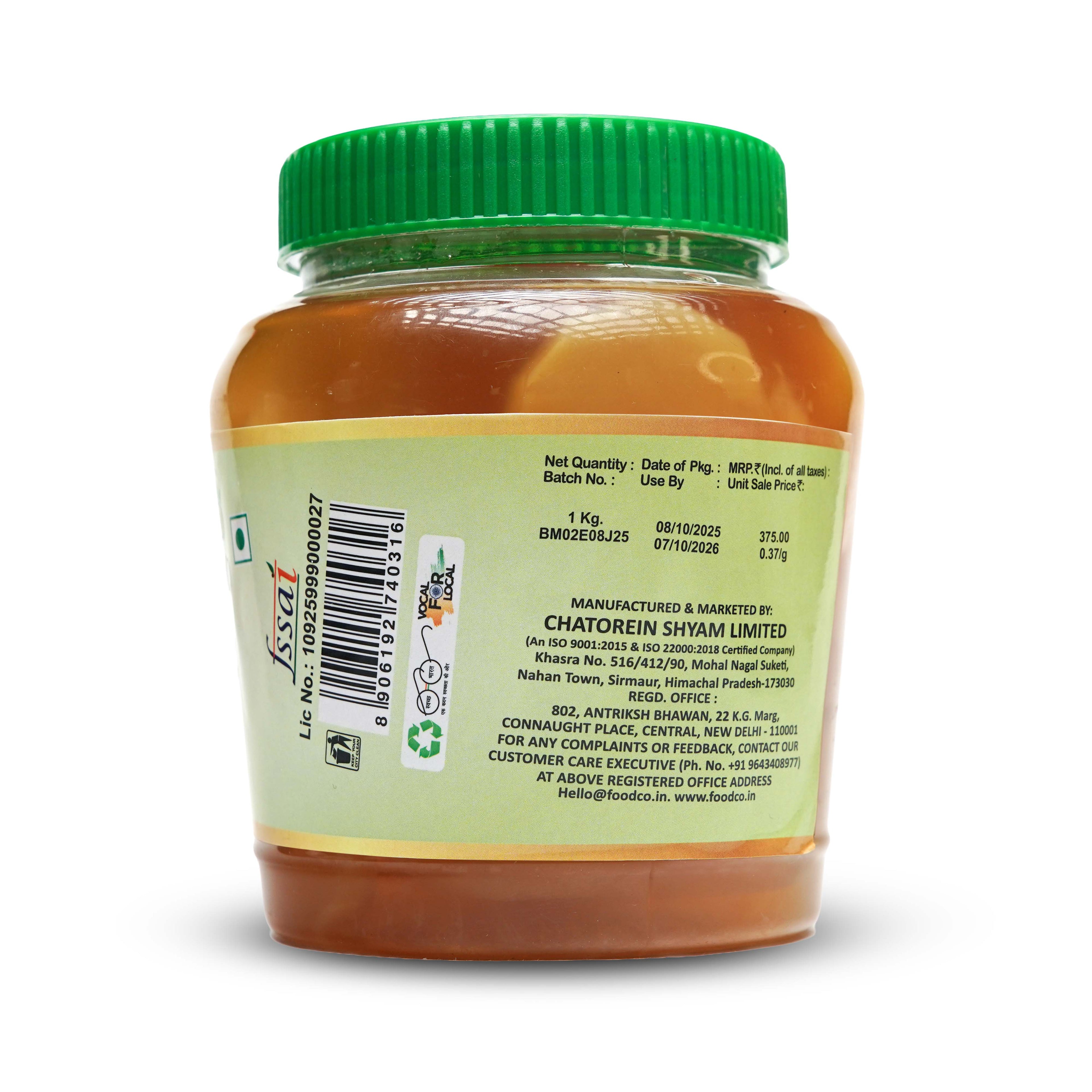 Jar of food with green lid and label on a white background
