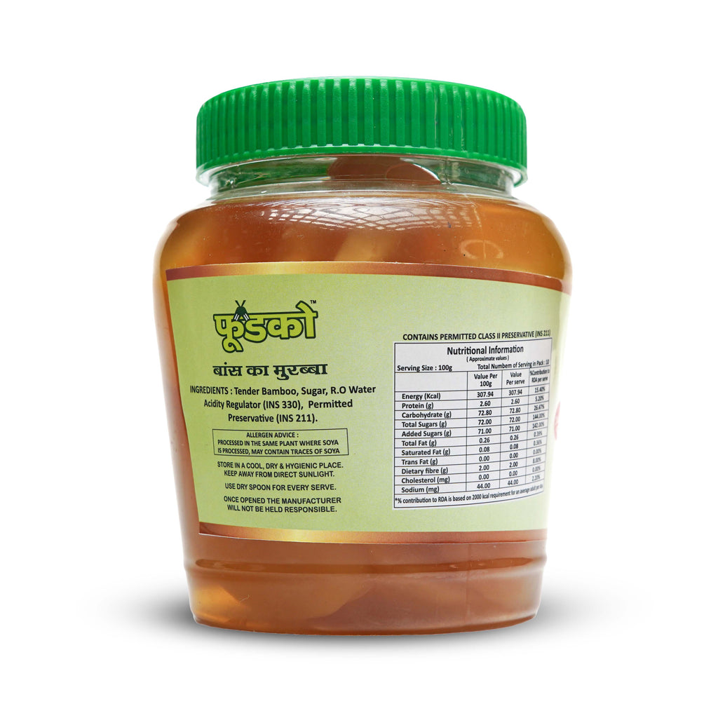 Jar of honey with a green lid on a white background