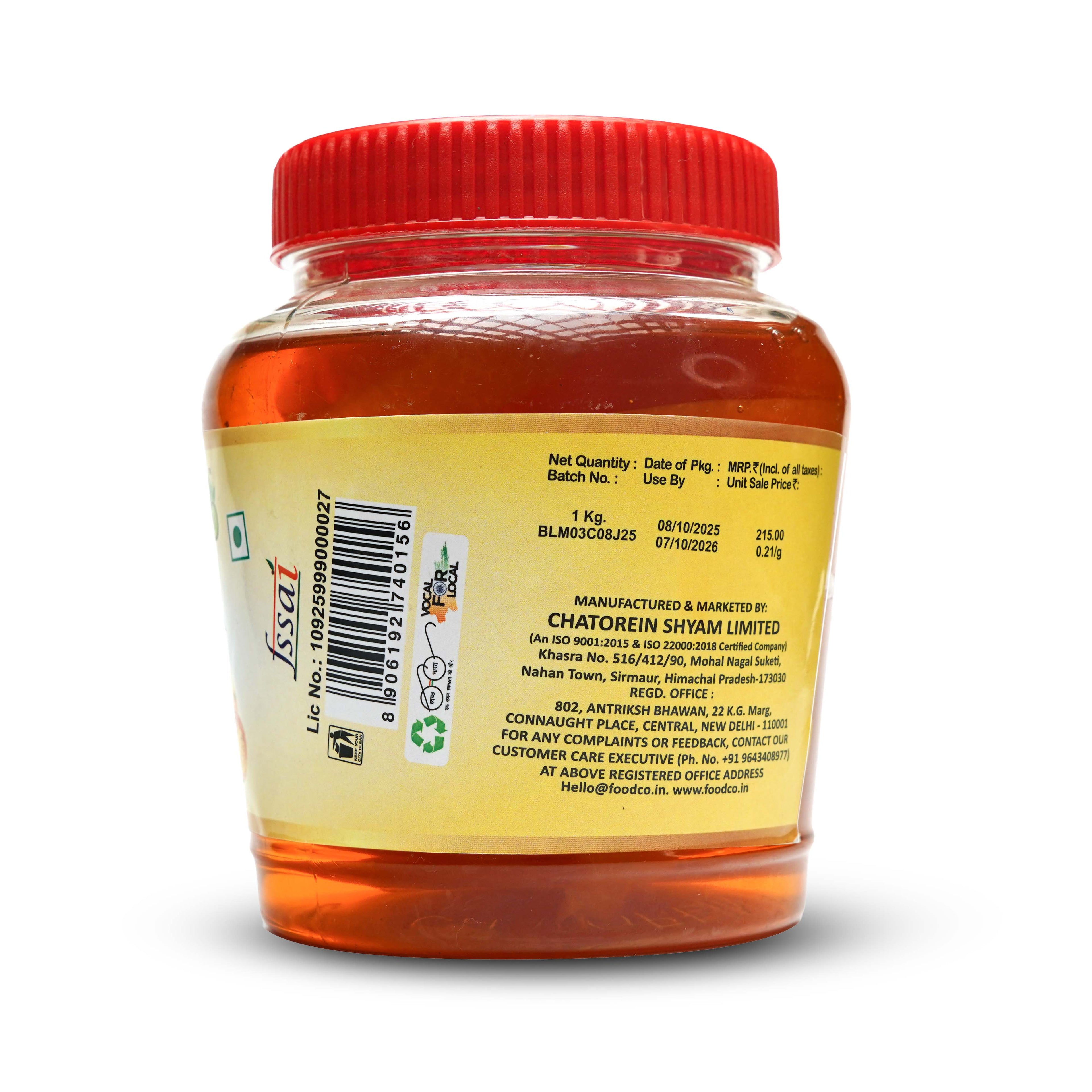 Jar of honey with a red lid on a white background