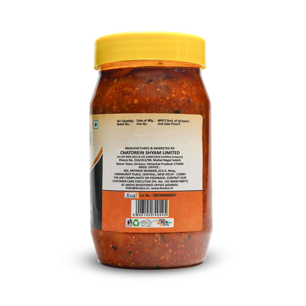 Jar of red chili paste with a yellow lid on a white background
