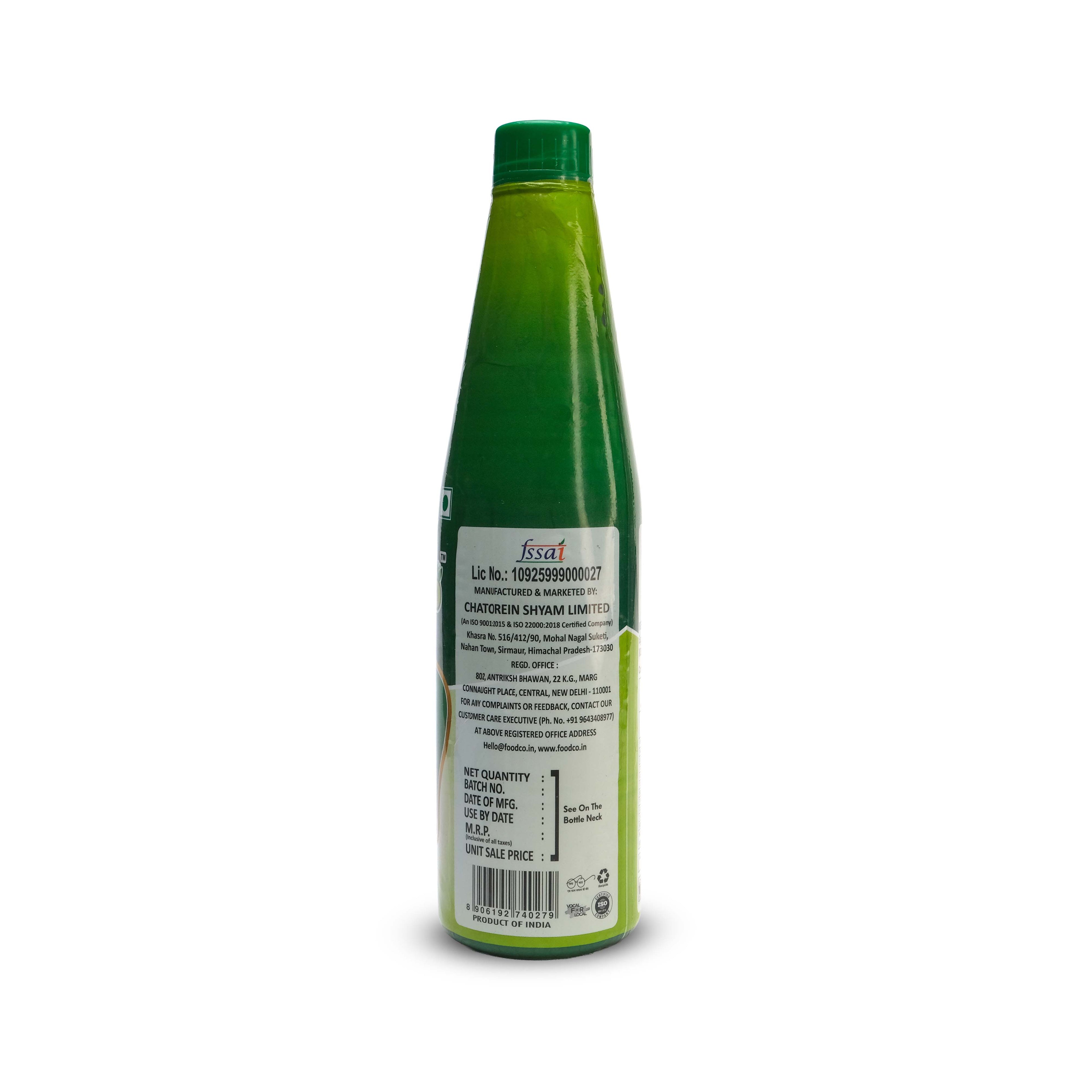 Green bottle with label on a white background