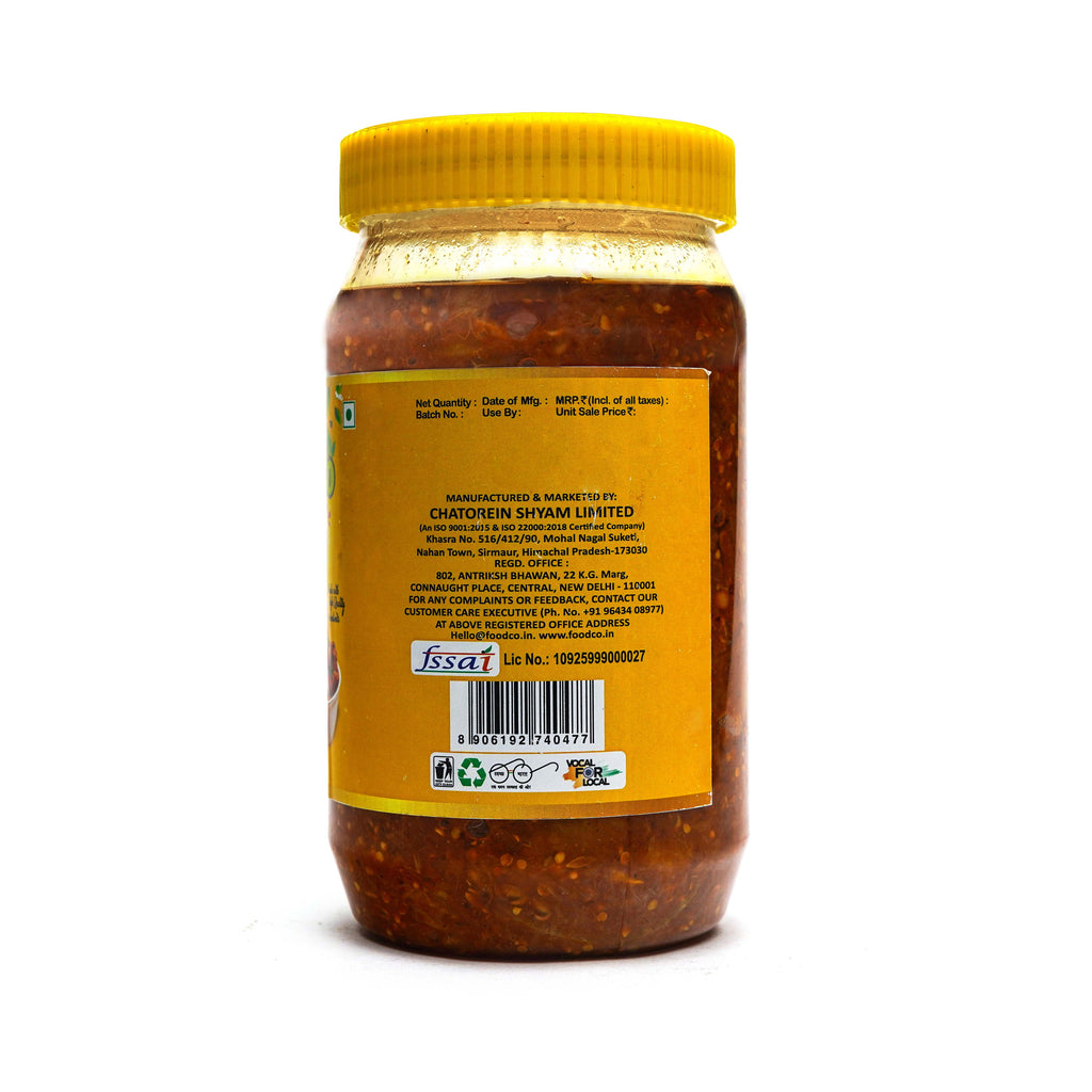 Jar of chutney with a yellow label on a white background