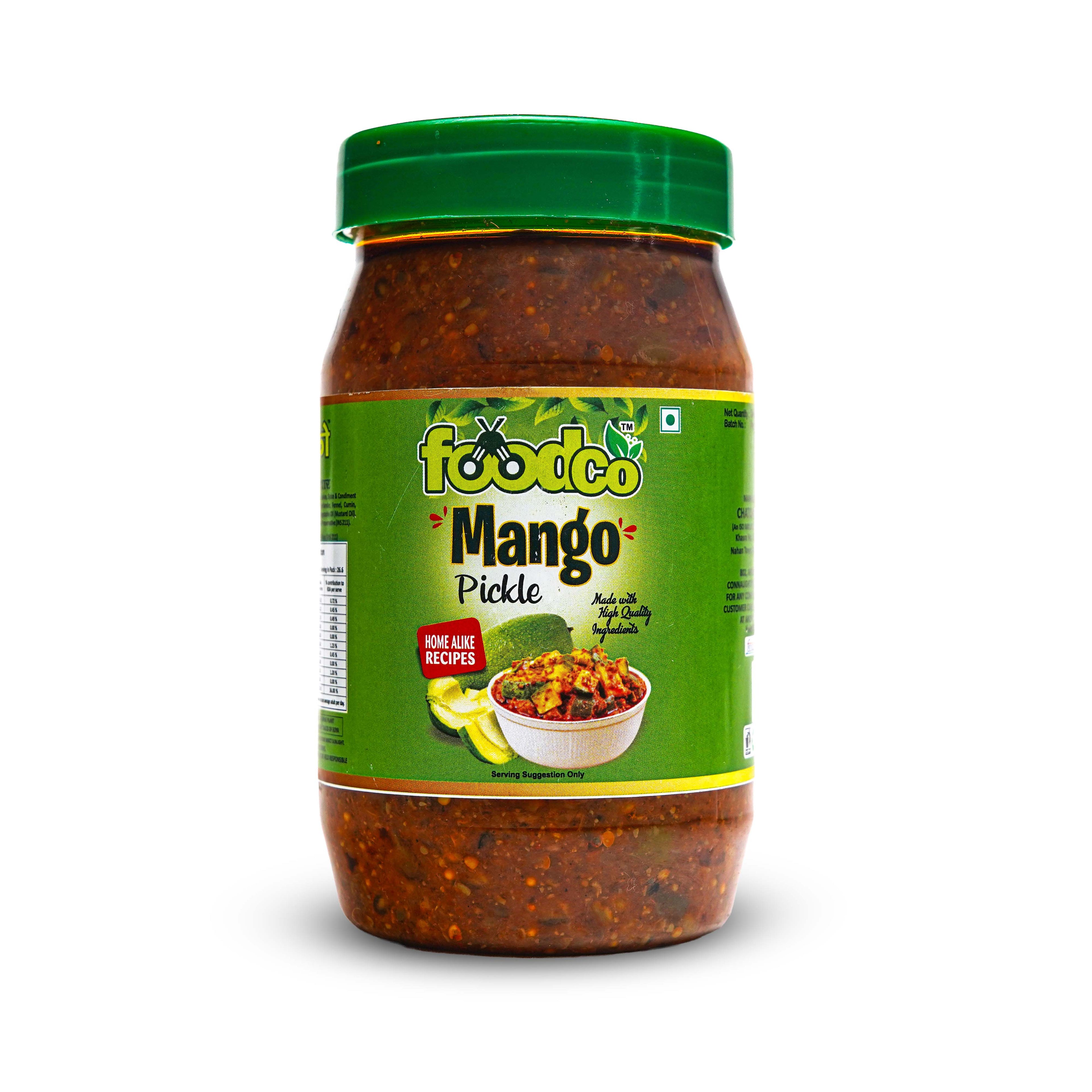 Jar of mango pickle with green lid and label on a white background