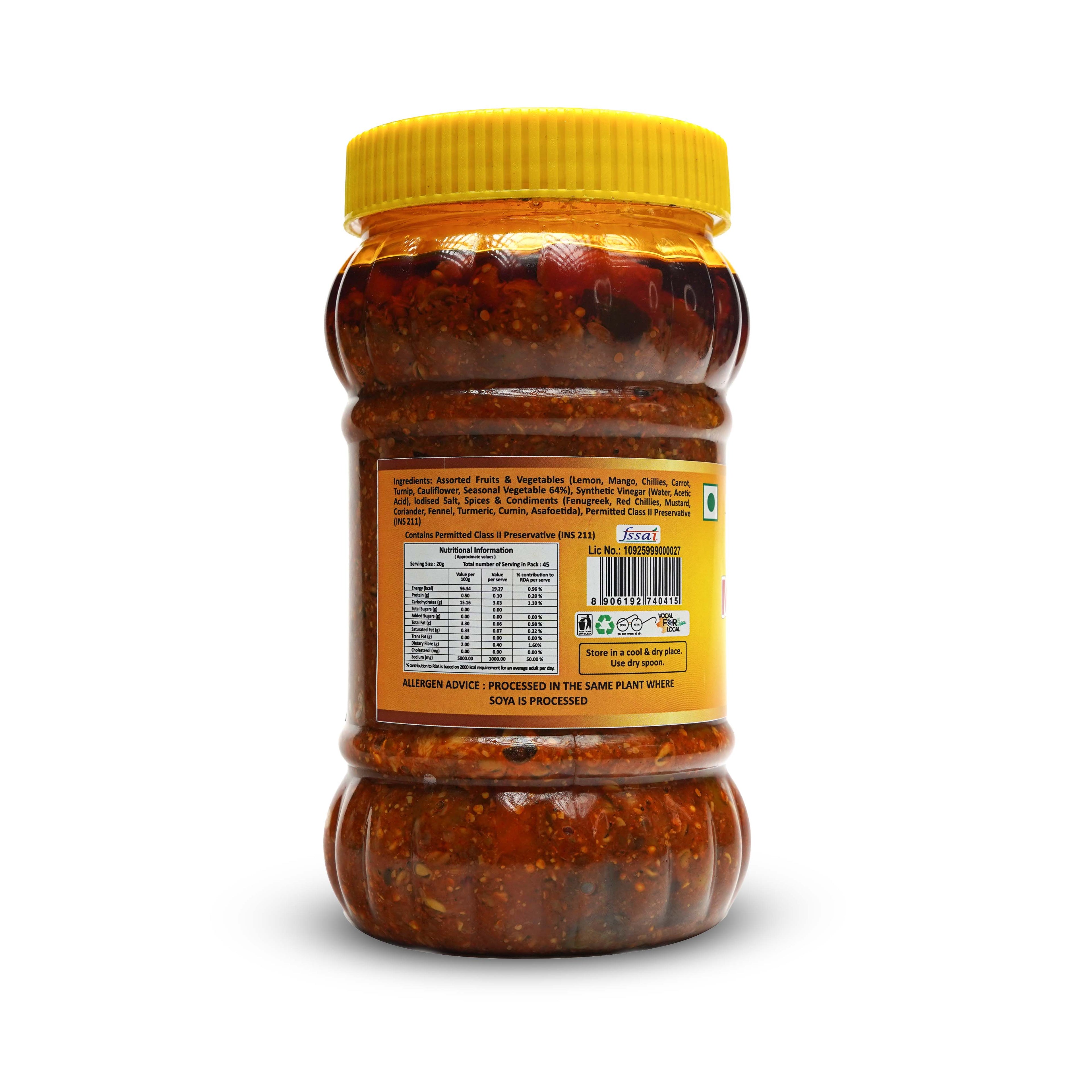 Jar of a condiment with a yellow lid on a white background