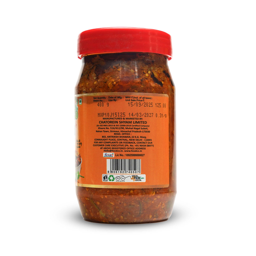 Jar of red chili paste with a red lid on a white background