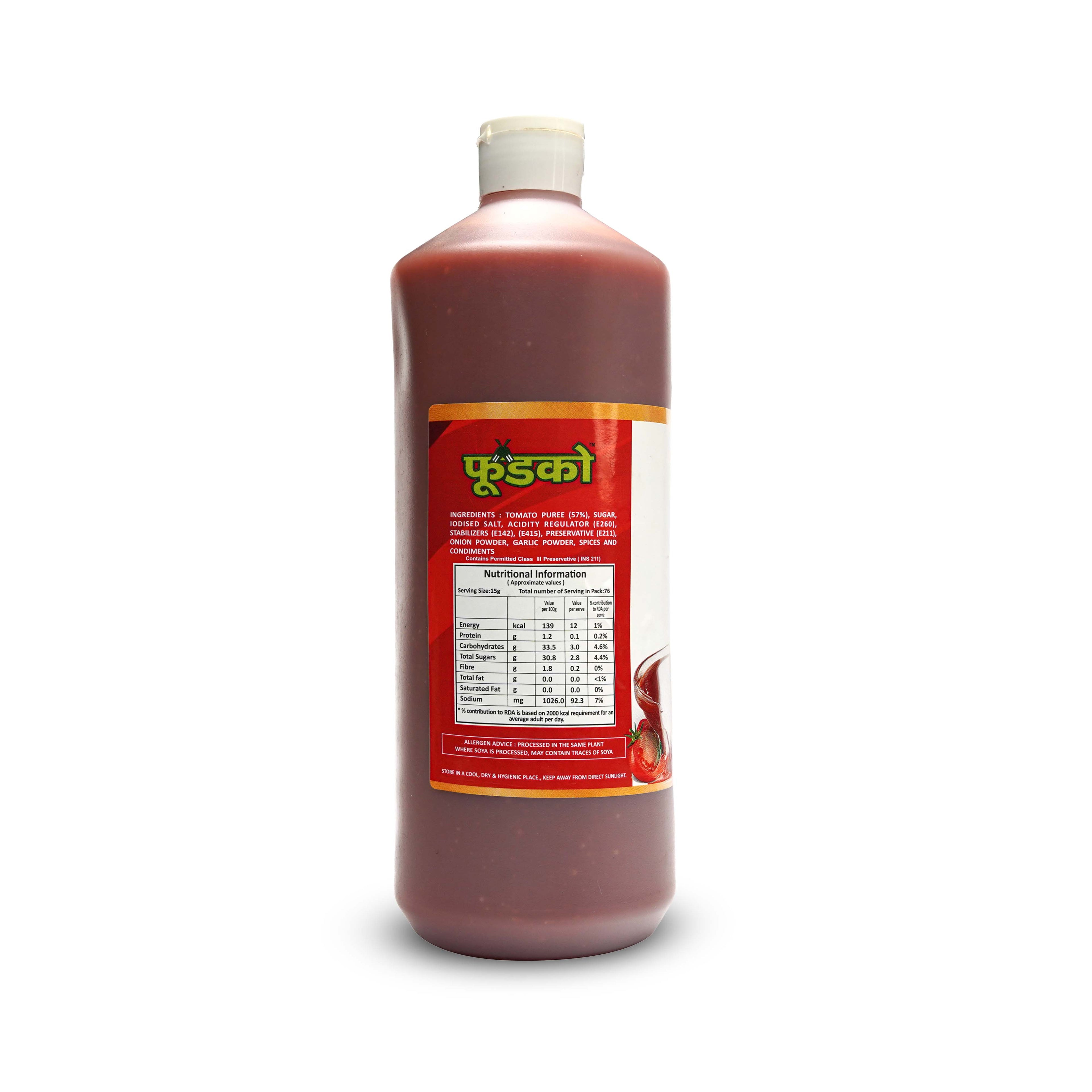Bottle of a red liquid with a label on a white background
