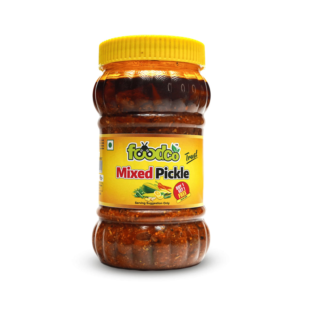 Jar of mixed pickle with yellow lid and label on a white background