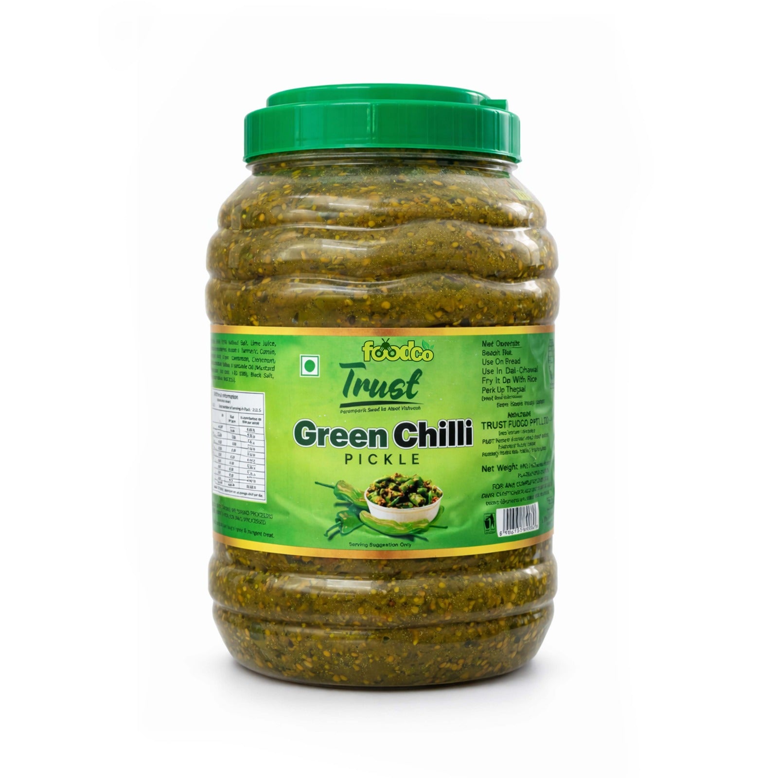 Jar of green chili pickle with a green lid on a white background